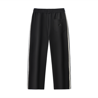 ODMPOD contrast side-stripe straight-leg pants showing a close-up of the black pants with white side stripe and tailored fit.