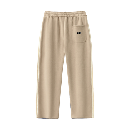 ODMPOD contrast side-stripe straight-leg pants showing a tailored fit with bold stripe details on the sides.