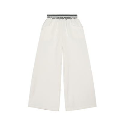 Striped ODMPOD wide-leg pants with a high waist and relaxed fit, featuring bold vertical stripes and flowy fabric.