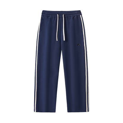 ODMPOD contrast side-stripe straight-leg pants, black and white, showcasing the stylish design and fitted silhouette.