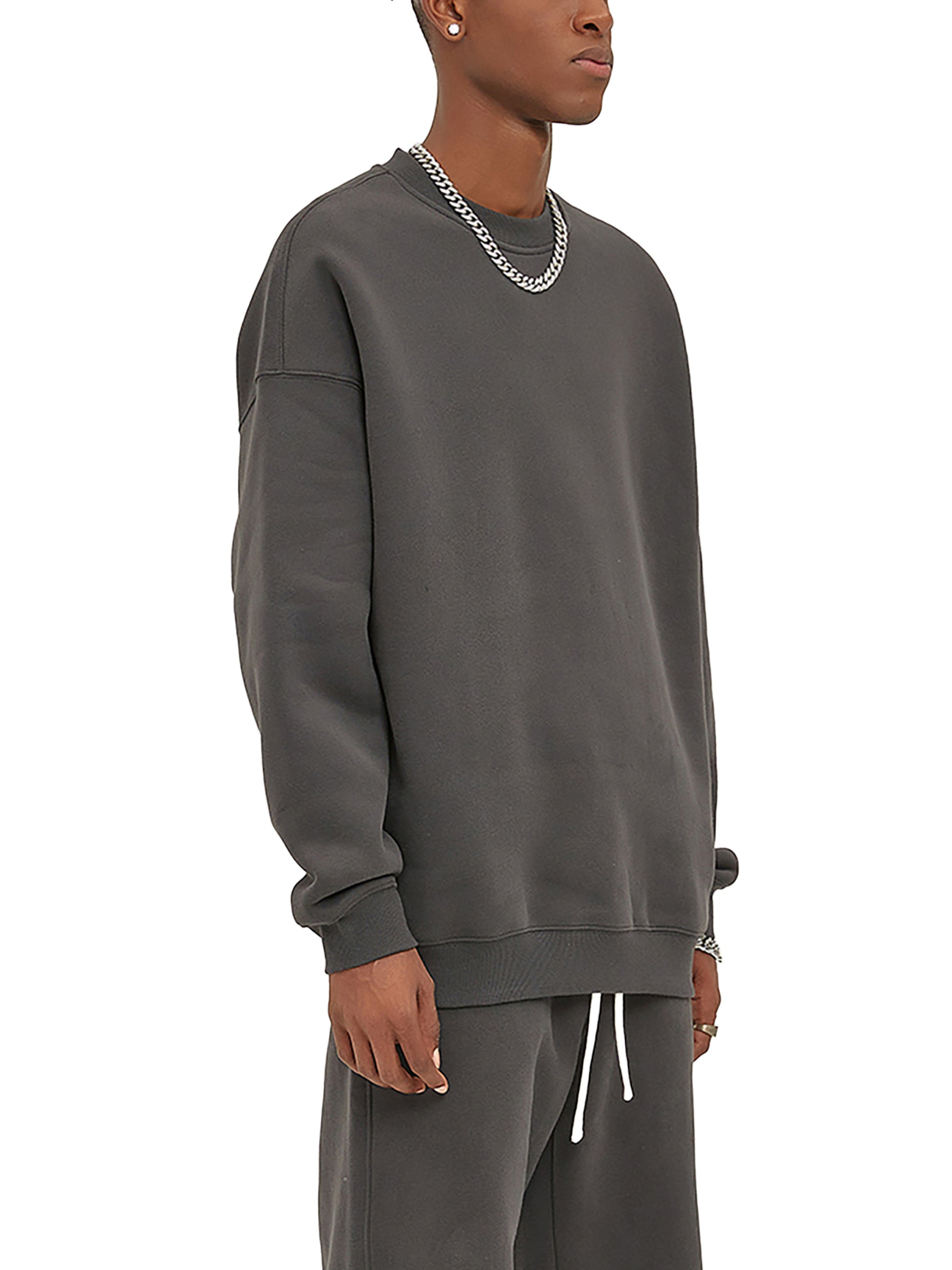 ODMPOD fleeced sweatshirt featuring a cozy, soft fabric with a relaxed fit, displayed on a hanger with a neutral background.