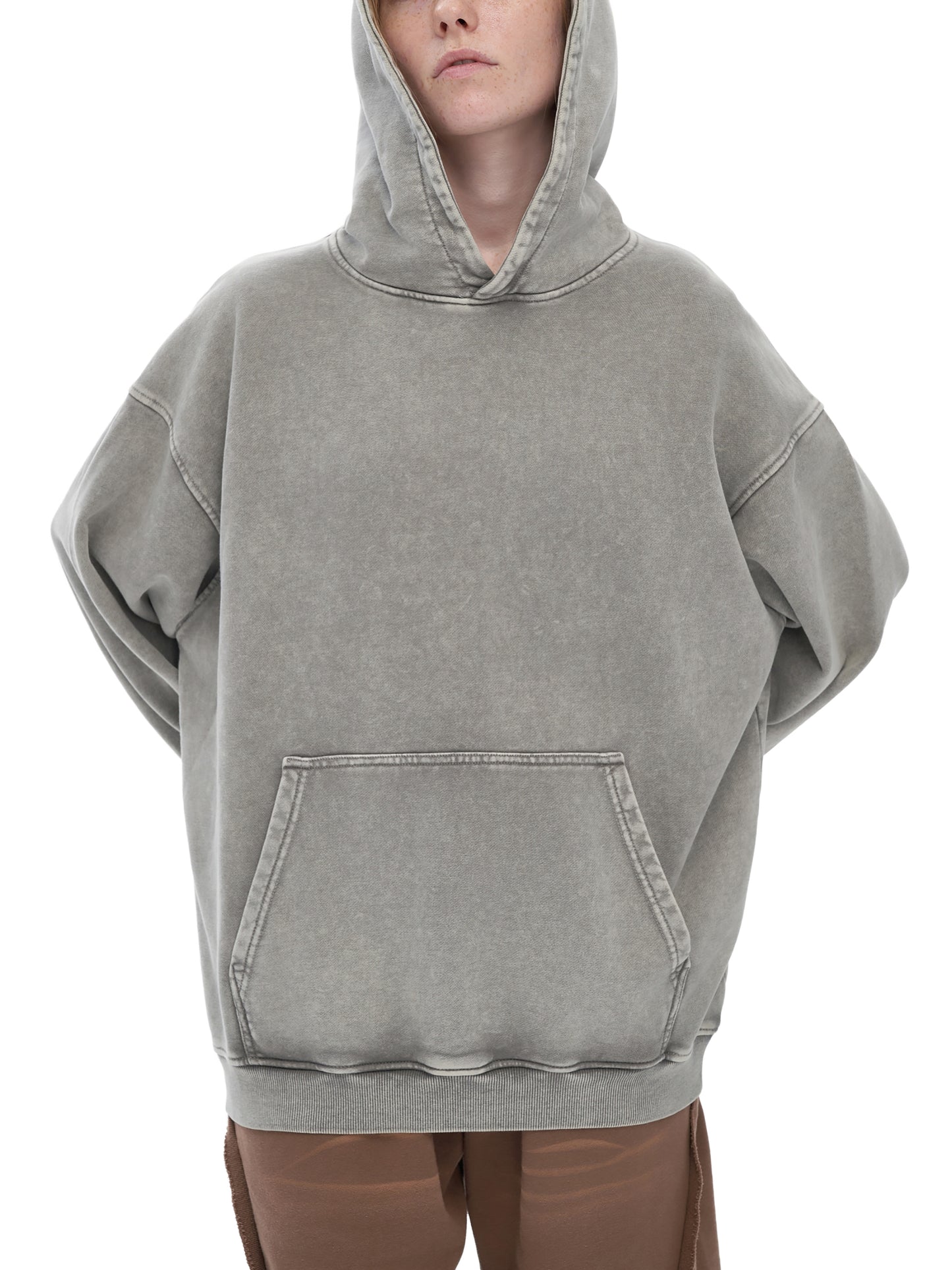 ODMPOD snow washed loose cotton hoodie with a relaxed fit, featuring a hood and front pocket, in soft, washed cotton fabric.