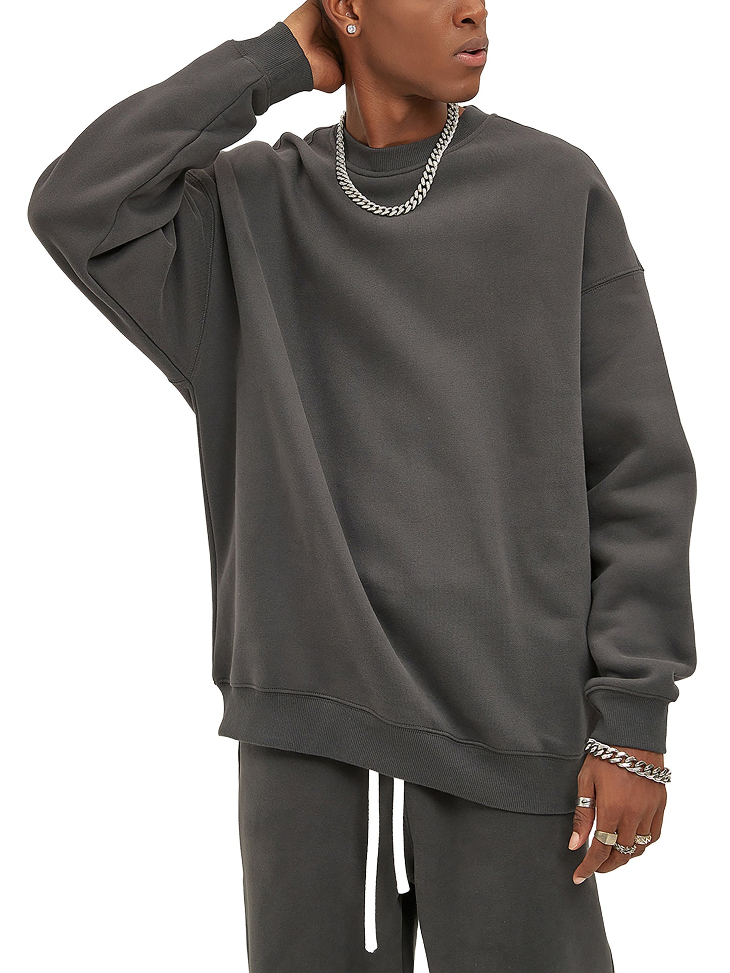ODMPOD fleeced sweatshirt showing a cozy, soft fabric in a relaxed fit with ribbed cuffs and hem, in a neutral color.