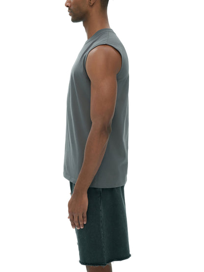 Men's sleeveless cotton tank top by ODMPOD, shown in white with a close-up of the fabric and sleeveless design.