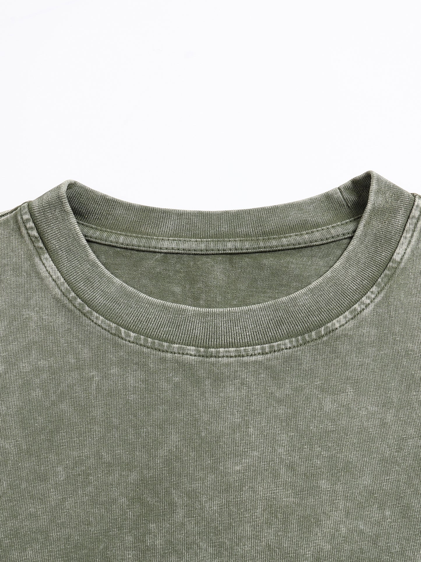 ODMPOD snow washed heavyweight oversized t-shirt displayed flat, showing its relaxed fit and textured fabric.