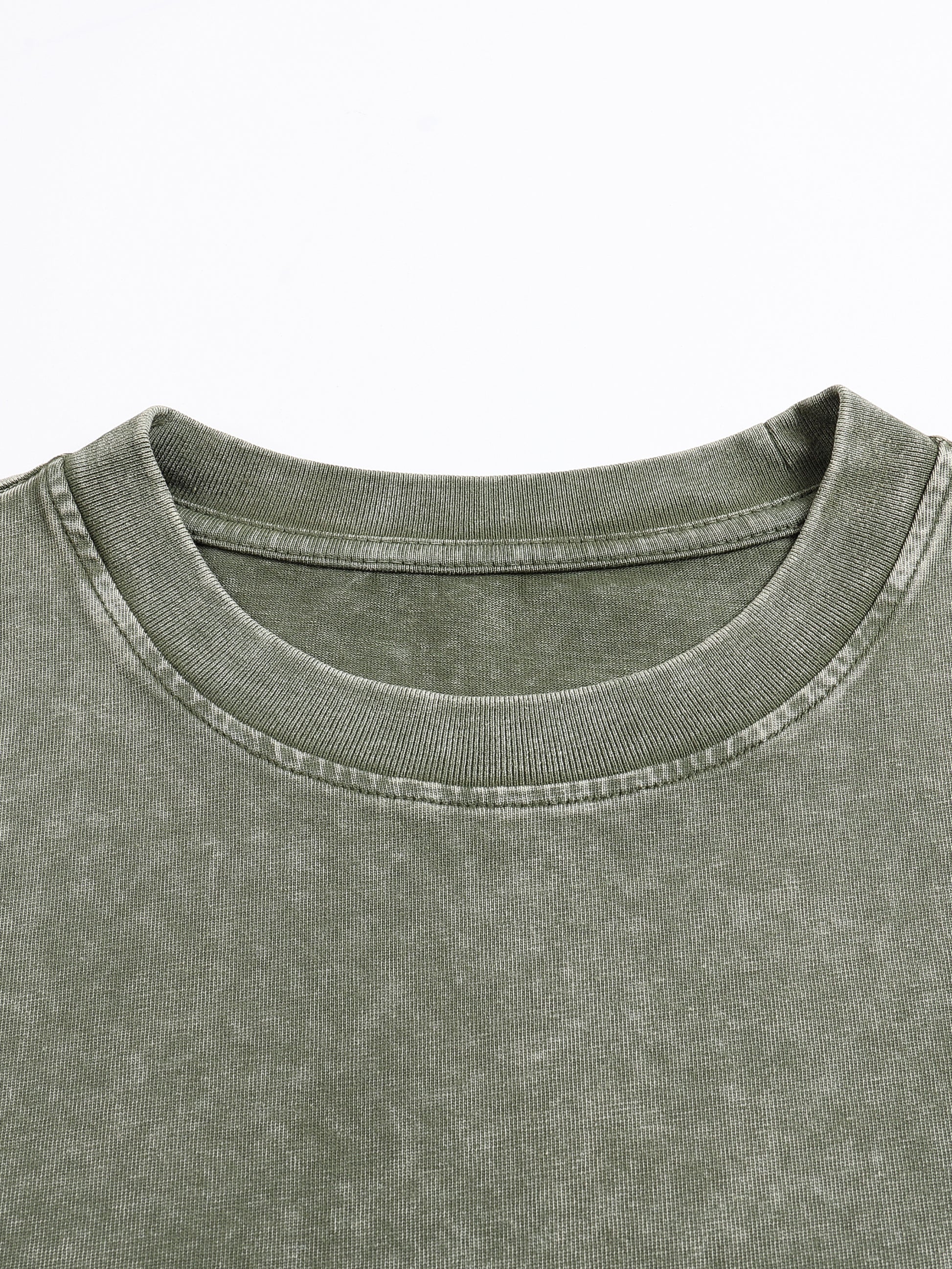 ODMPOD snow washed heavyweight oversized t-shirt displayed flat, showing its relaxed fit and textured fabric.
