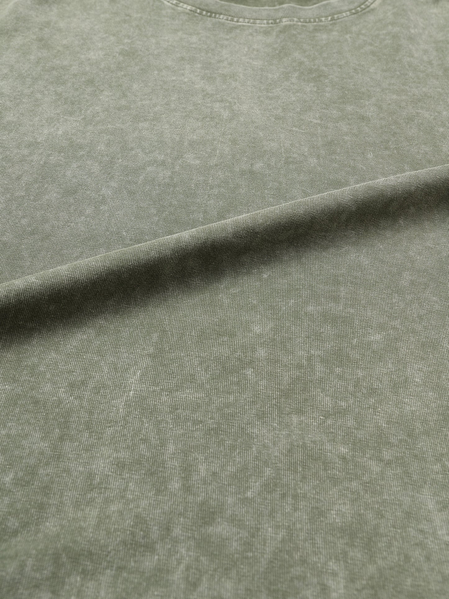 Snow Washed Heavyweight Oversize T-Shirt by ODMPOD, showing a relaxed fit in soft, textured fabric with a casual style.