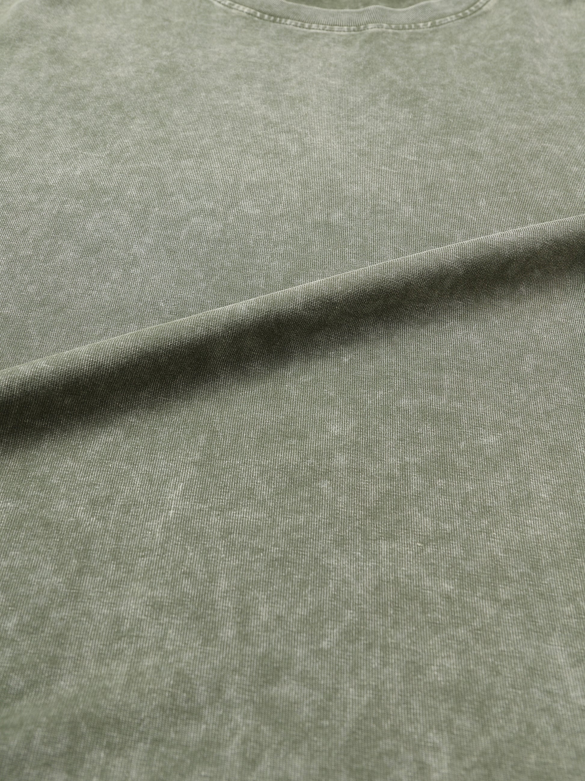 Snow Washed Heavyweight Oversize T-Shirt by ODMPOD, showing a relaxed fit in soft, textured fabric with a casual style.