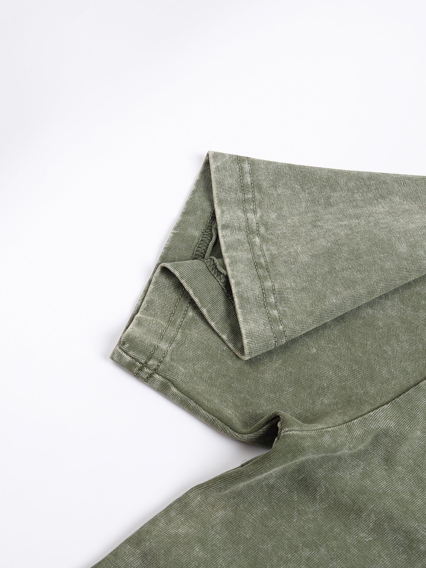 Light gray ODMPOD Snow Washed Heavyweight Oversize T-Shirt displayed flat, showing its relaxed fit and soft, washed fabric.