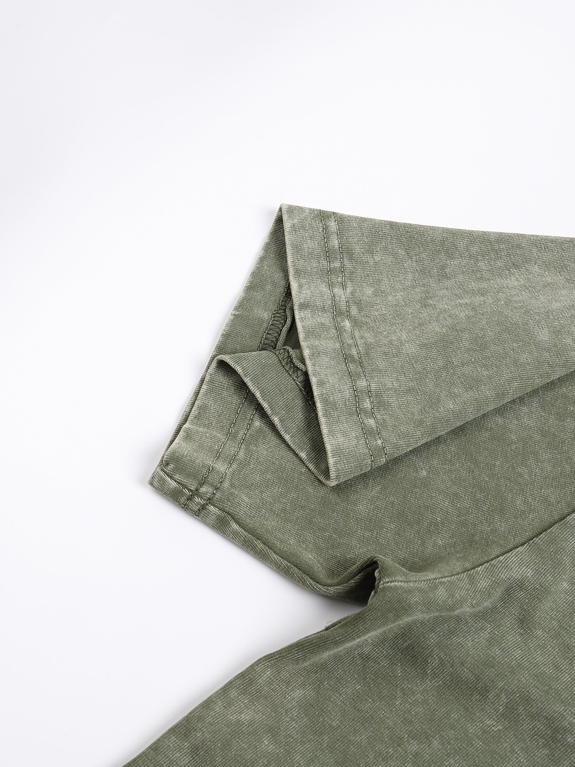 Light gray ODMPOD Snow Washed Heavyweight Oversize T-Shirt displayed flat, showing its relaxed fit and soft, washed fabric.