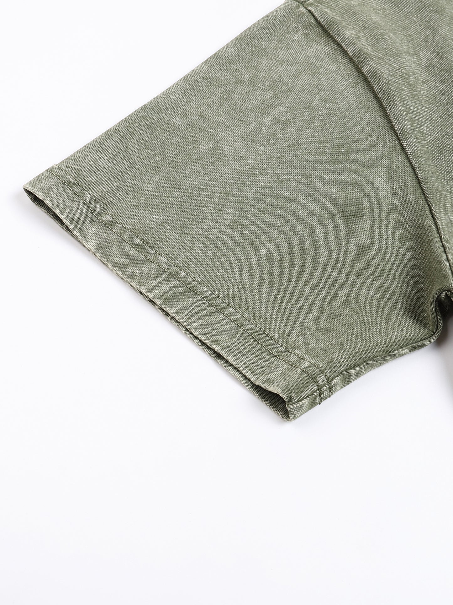 Light grey snow washed heavyweight oversized T-shirt by ODMPOD, shown on a hanger with a relaxed fit and soft fabric texture.
