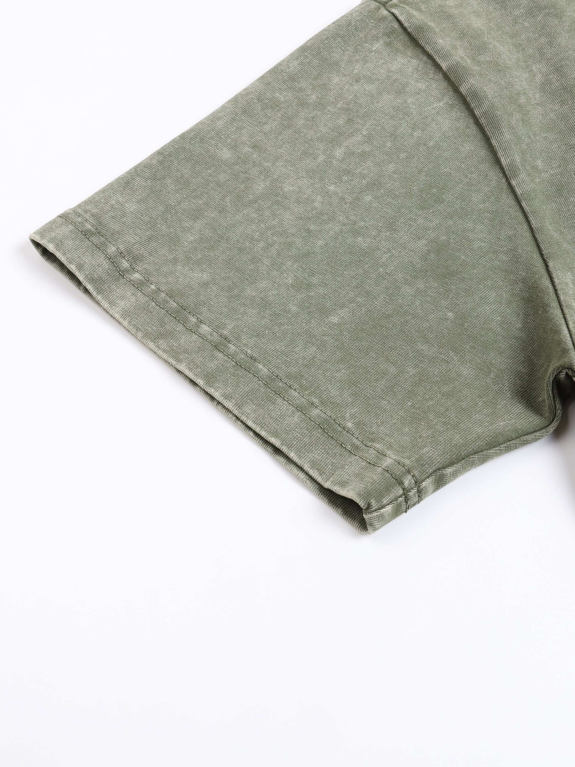 Light grey snow washed heavyweight oversized T-shirt by ODMPOD, shown on a hanger with a relaxed fit and soft fabric texture.