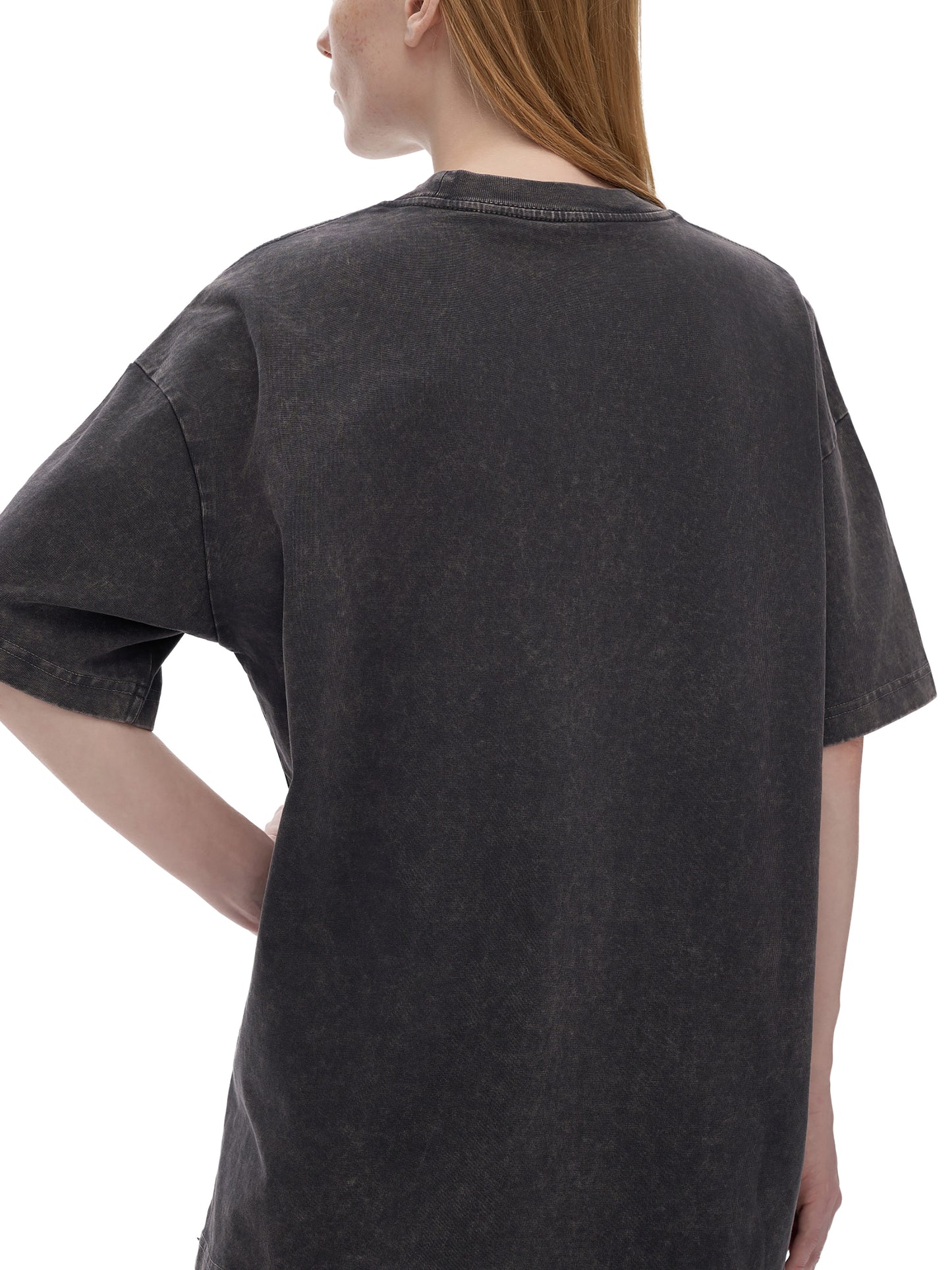 Light gray ODMPOD Snow Washed Heavyweight Oversize T-Shirt displayed on a hanger with a relaxed fit and soft fabric texture.
