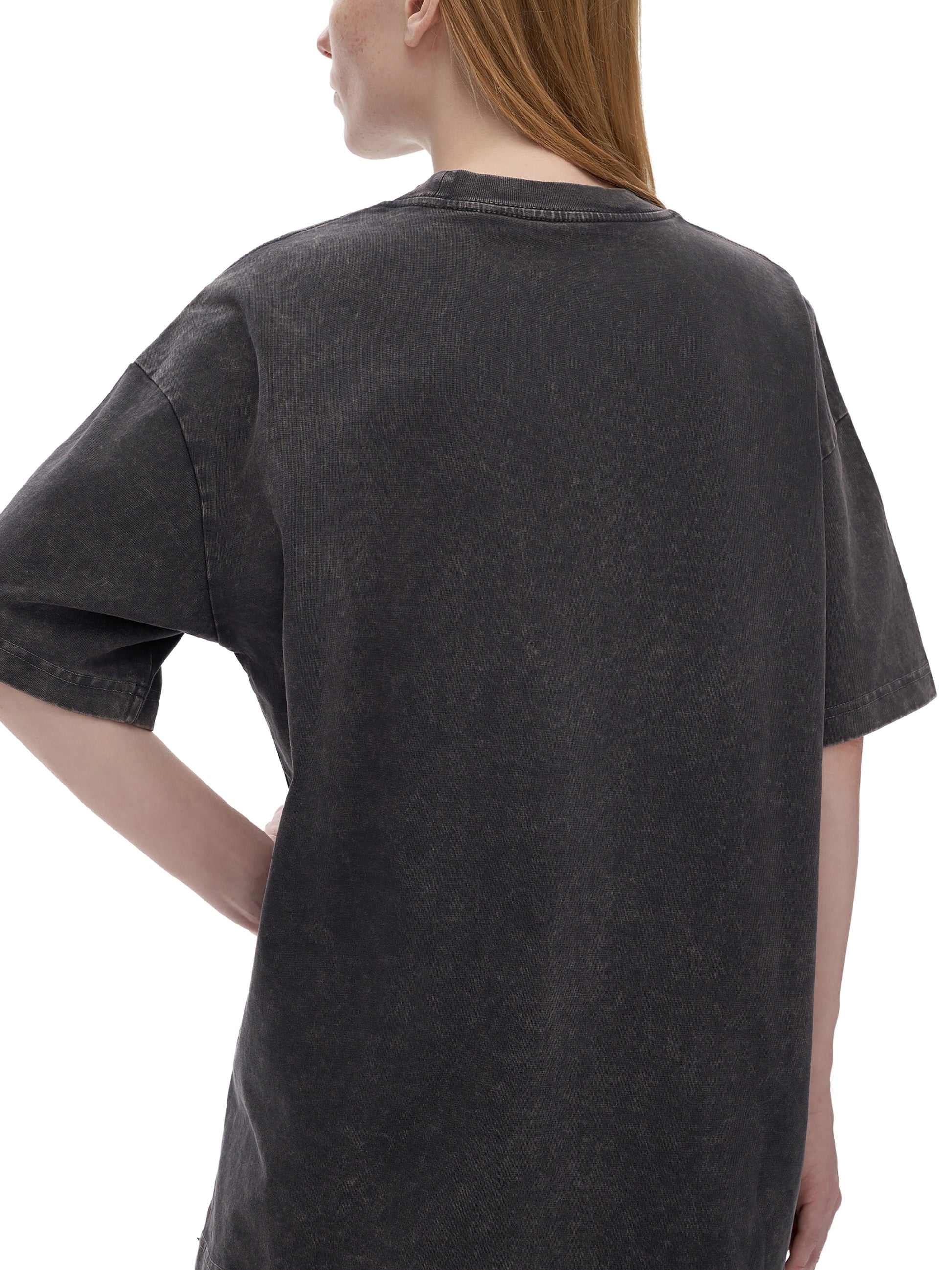 Light gray ODMPOD Snow Washed Heavyweight Oversize T-Shirt displayed on a hanger with a relaxed fit and soft fabric texture.
