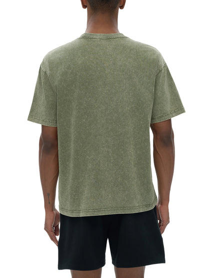 Oversized snow washed heavyweight ODMPOD t-shirt in a relaxed fit, showing soft fabric and casual style.