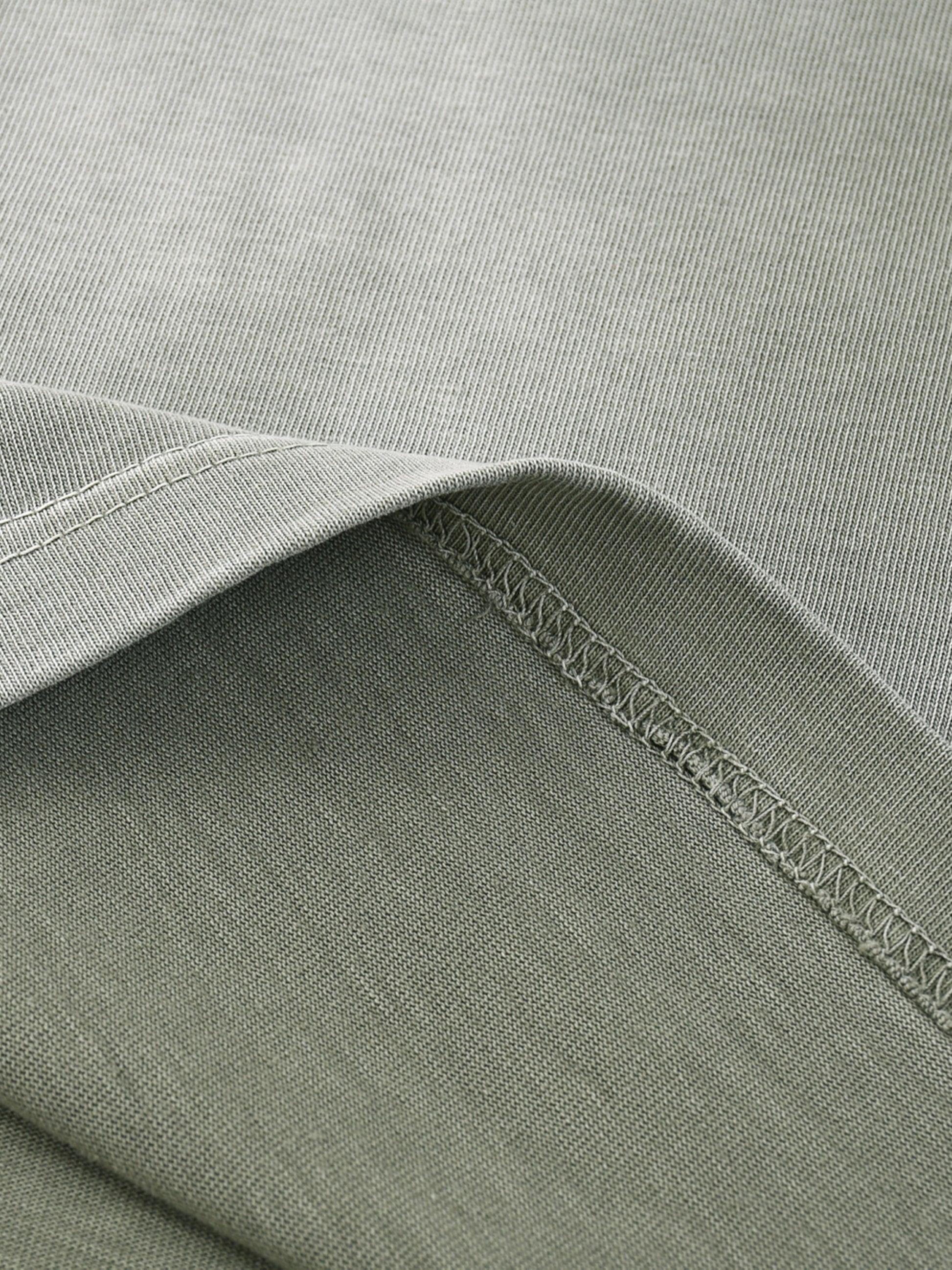 ODMPOD I shape gradient washed T-shirt displayed flat with soft pastel colors and subtle washed texture.