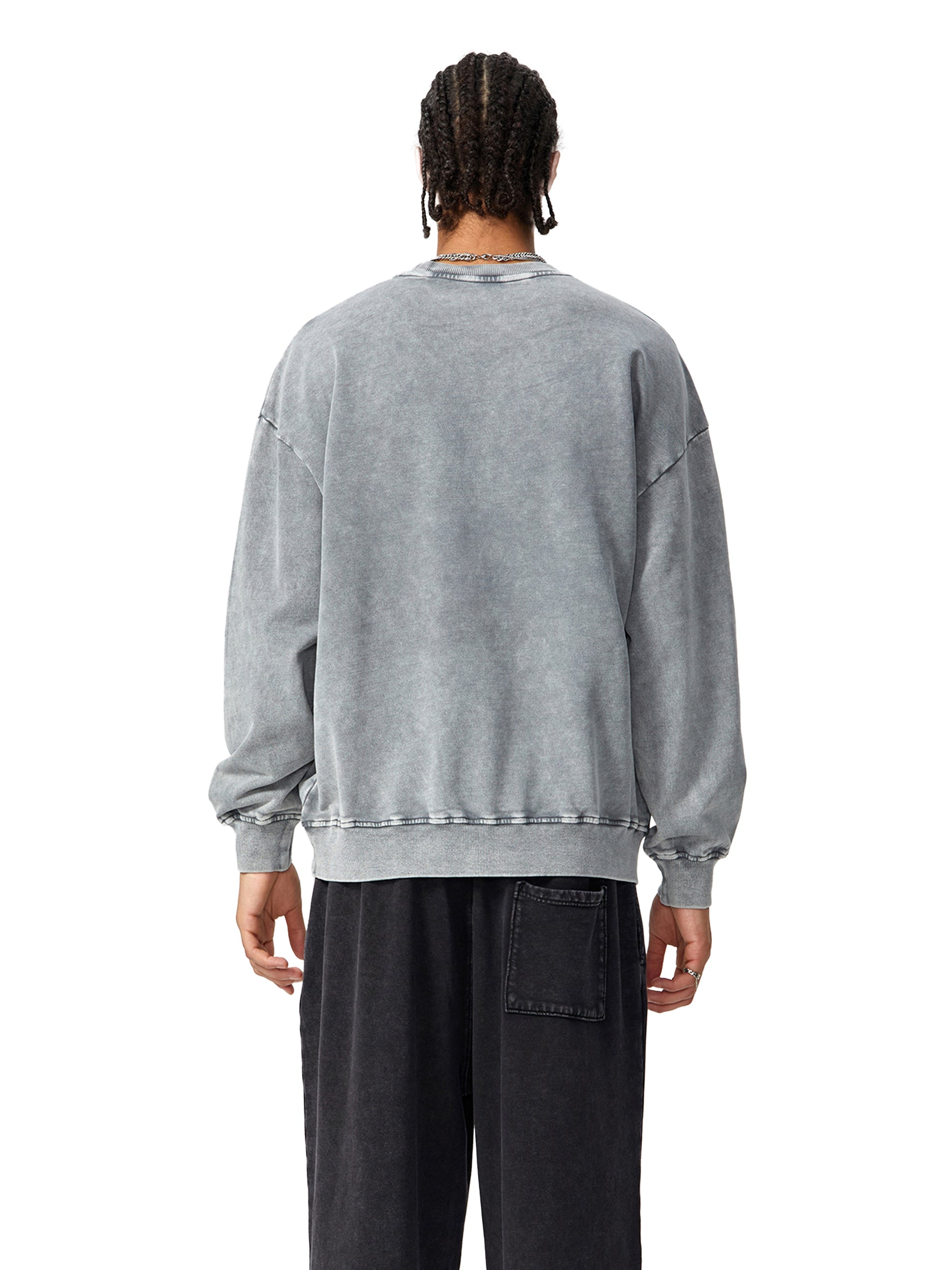 ODMPOD Snow Washed Oversized Sweatshirt in light gray, soft fabric, relaxed fit, with a casual style and subtle fading details.