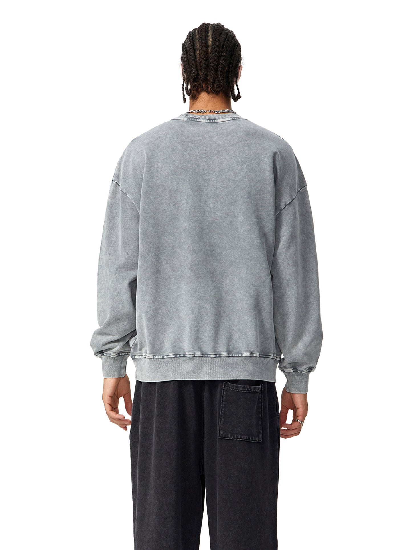 ODMPOD Snow Washed Oversized Sweatshirt in soft fabric, showing a relaxed fit with a washed, textured finish