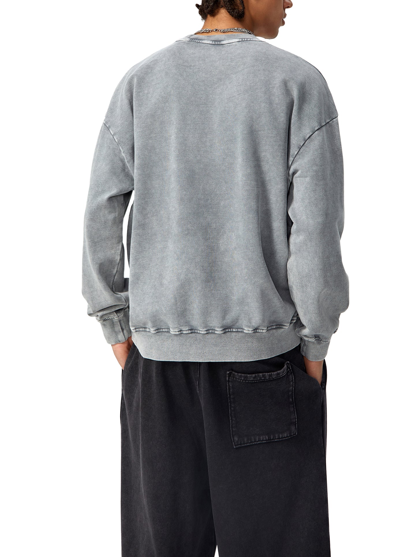 ODMPOD snow washed oversized sweatshirt in soft, relaxed fit with a casual, cozy appearance. Lightly textured fabric shown.