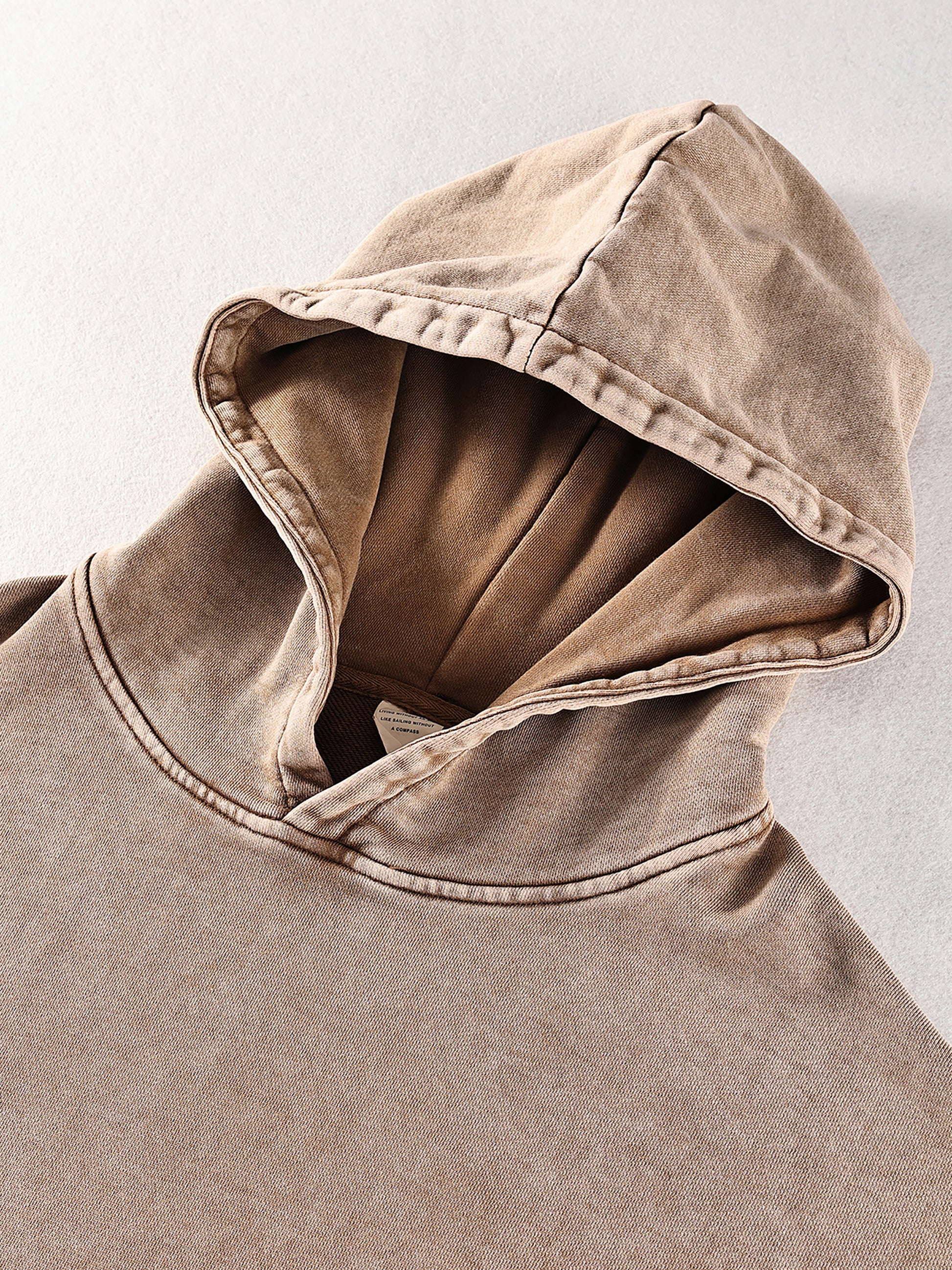 ODMPOD Snow Washed Loose Cotton Hoodie showing soft, relaxed fit with hood and long sleeves in a casual style.