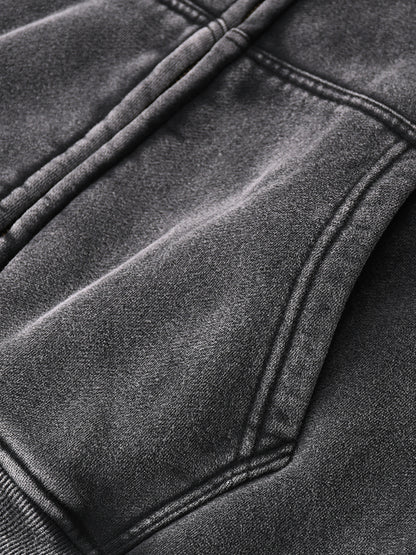 Gray zip-through boxy fleece hoodie by ODMPOD with a high collar and relaxed fit, shown on a model.
