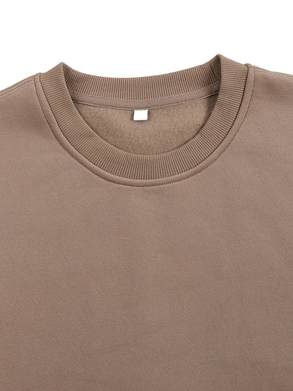 ODMPOD fleeced sweatshirt with soft, cozy fabric and a relaxed fit, shown in a front view with ribbed cuffs and neckline.
