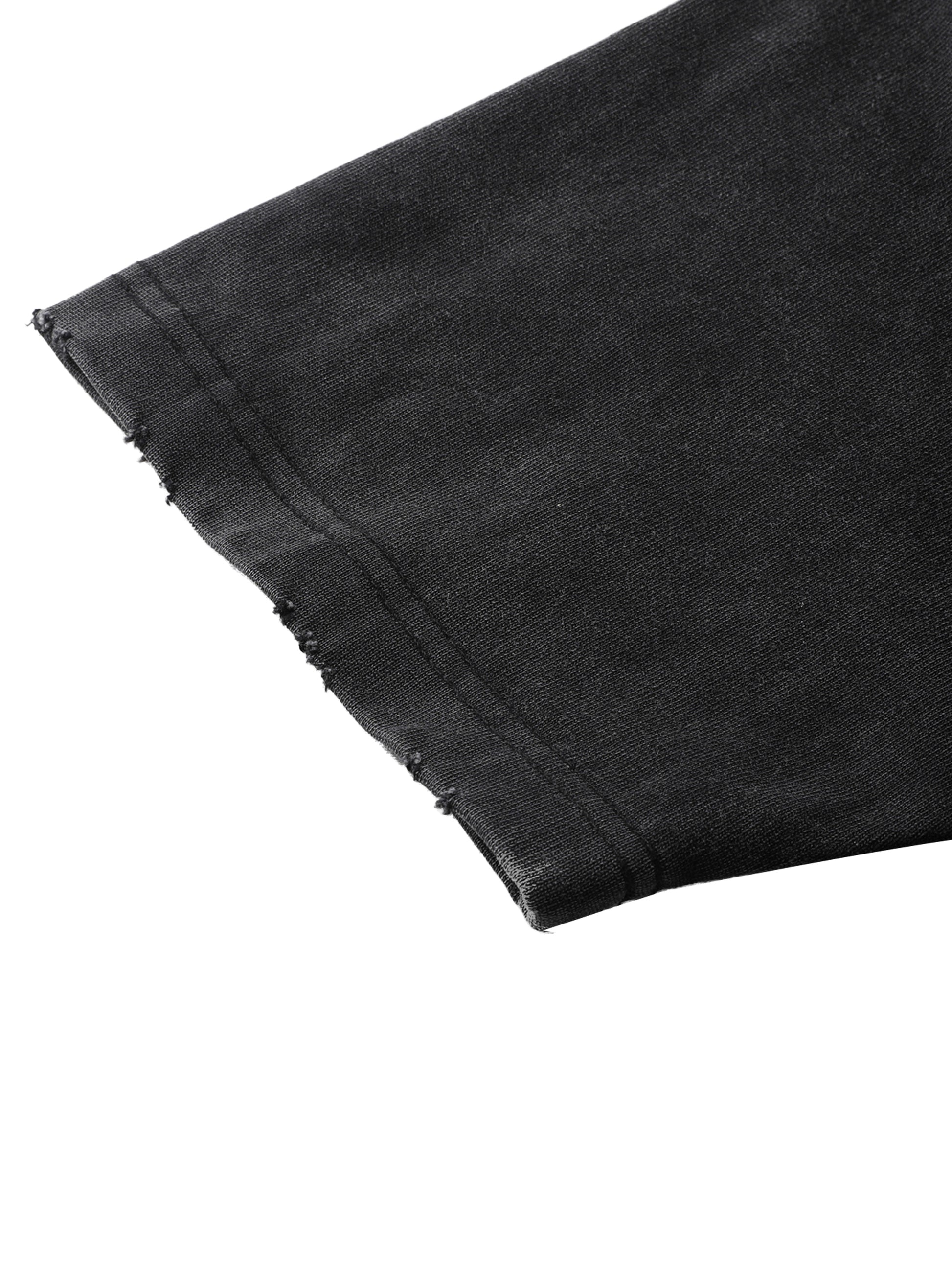 Vintage washed heavyweight ODMPOD t-shirt with frayed edges, showcasing a casual, worn-in style and textured fabric.