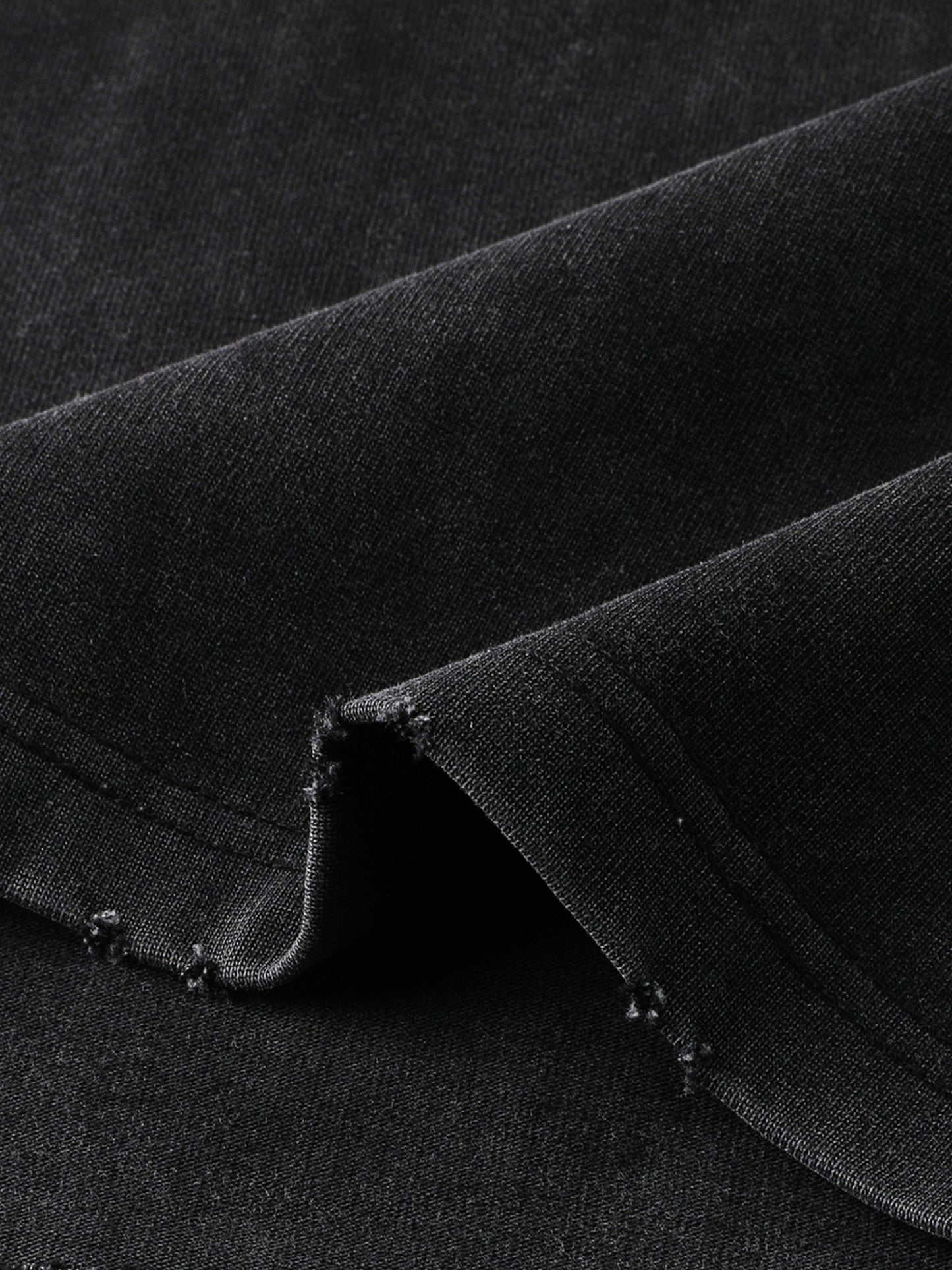 Vintage washed heavyweight ODMPOD T-shirt with frayed edges, showing a casual fit and distressed fabric detail.