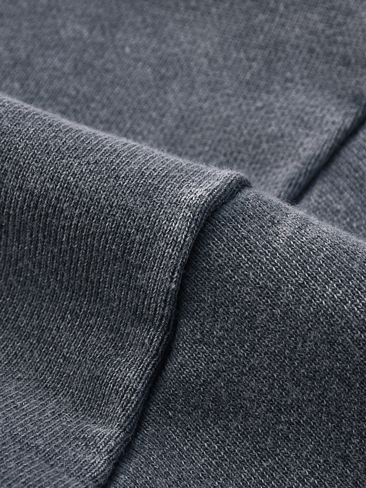 Snow Washed Raw Edge Cropped Sweatshirt by ODMPOD, showcasing a distressed raw hem, soft fabric, and relaxed fit on a mannequin