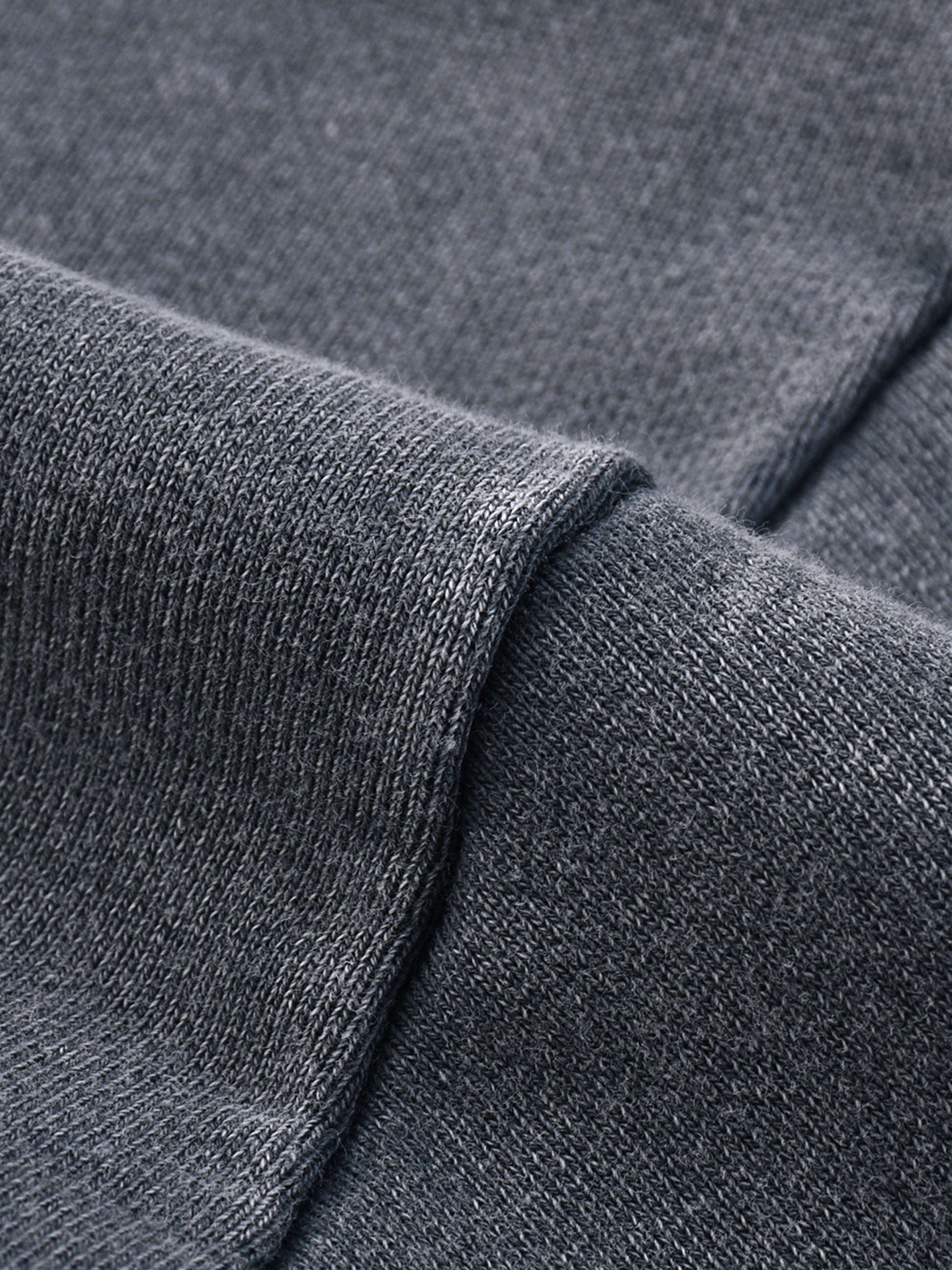 Snow Washed Raw Edge Cropped Sweatshirt by ODMPOD, showcasing a distressed raw hem, soft fabric, and relaxed fit on a mannequin