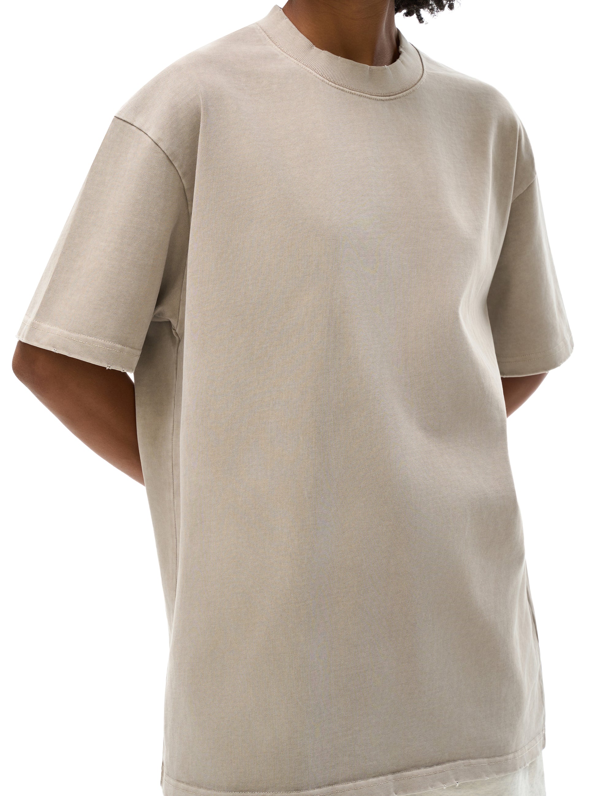 ODMPOD vintage washed heavyweight frayed T-shirt displayed with distressed fabric and relaxed fit, showcasing a casual, worn-in style.