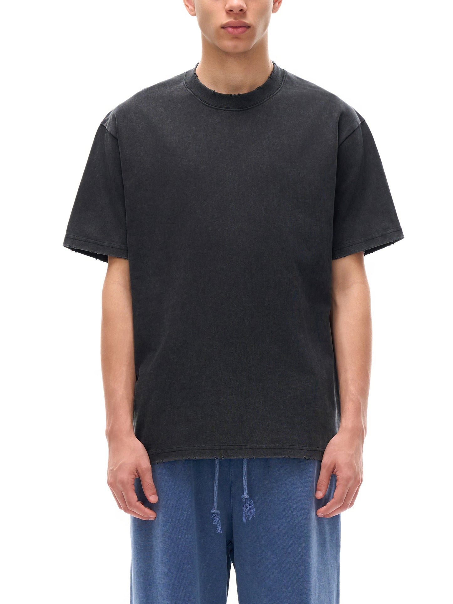 ODMPOD heavyweight vintage washed frayed t-shirt with distressed edges, casual style, shown on a plain background.