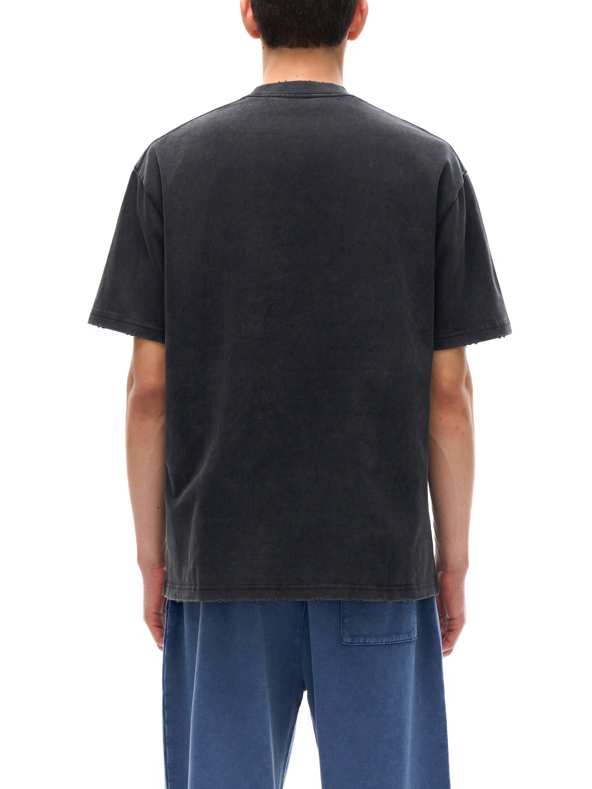 Vintage washed heavyweight ODMPOD T-shirt with frayed edges, showcasing a relaxed, worn-in look and classic crew neck design.