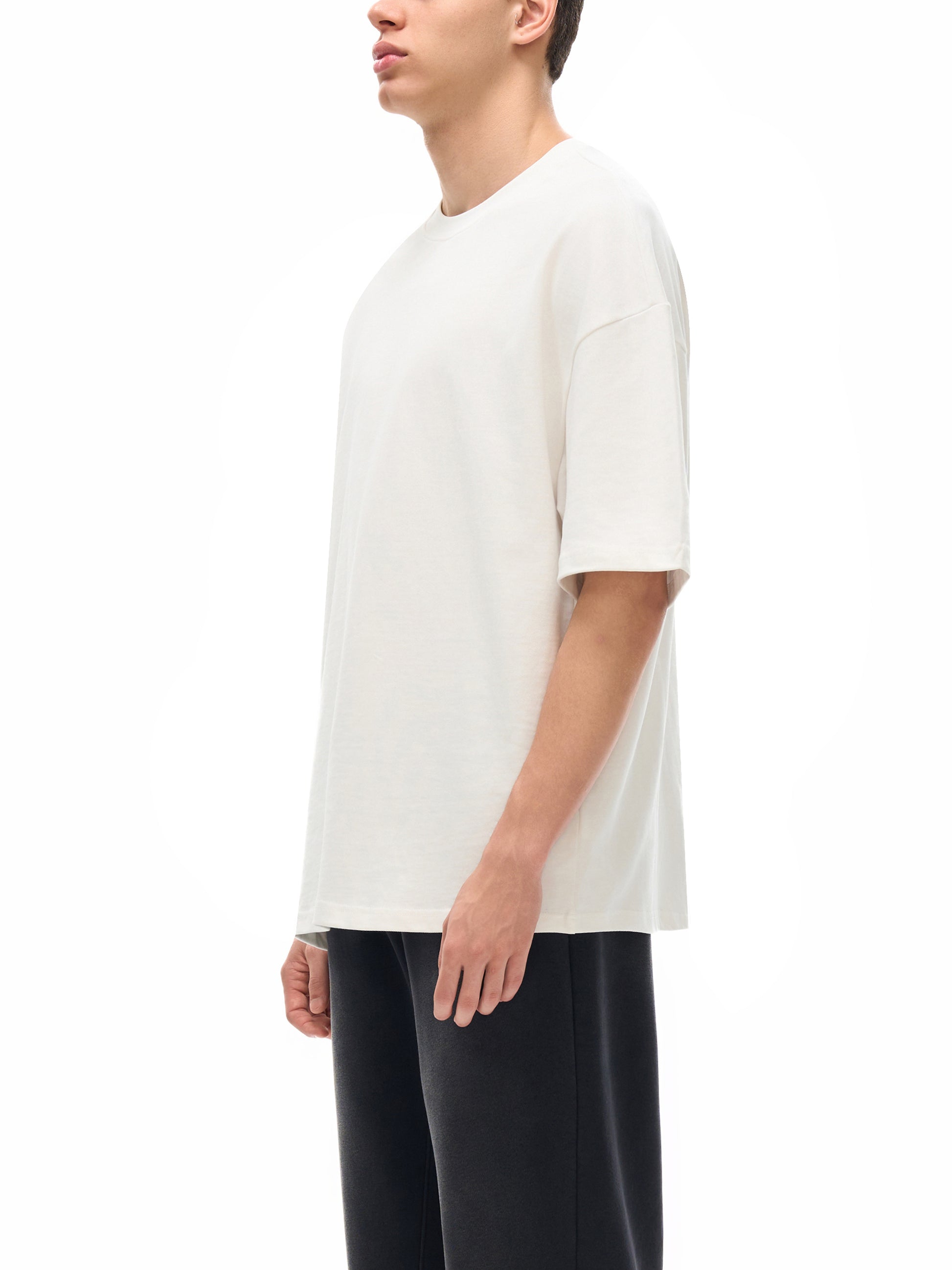ODMPOD Essential Heavyweight Cotton T-Shirt in a classic fit, featuring a soft, durable fabric and simple crew neckline.
