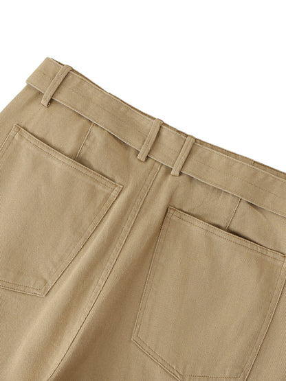 ODMPOD belted barrel-leg chino pants in khaki with front pockets and cuffed hems, displayed on a model.