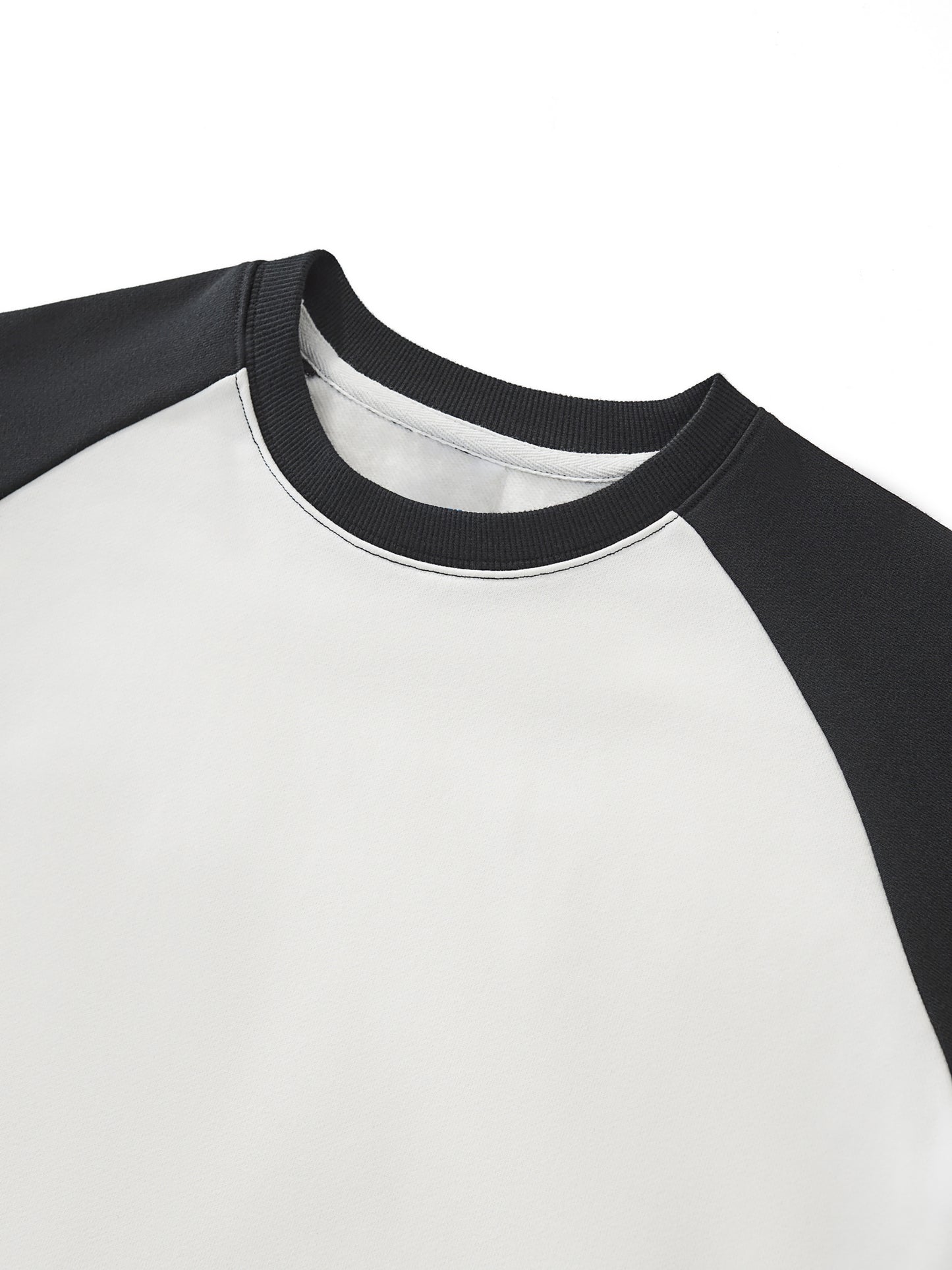 ODMPOD raw-hem color-block raglan crop sweatshirt with contrasting sleeves and a casual, trendy fit.