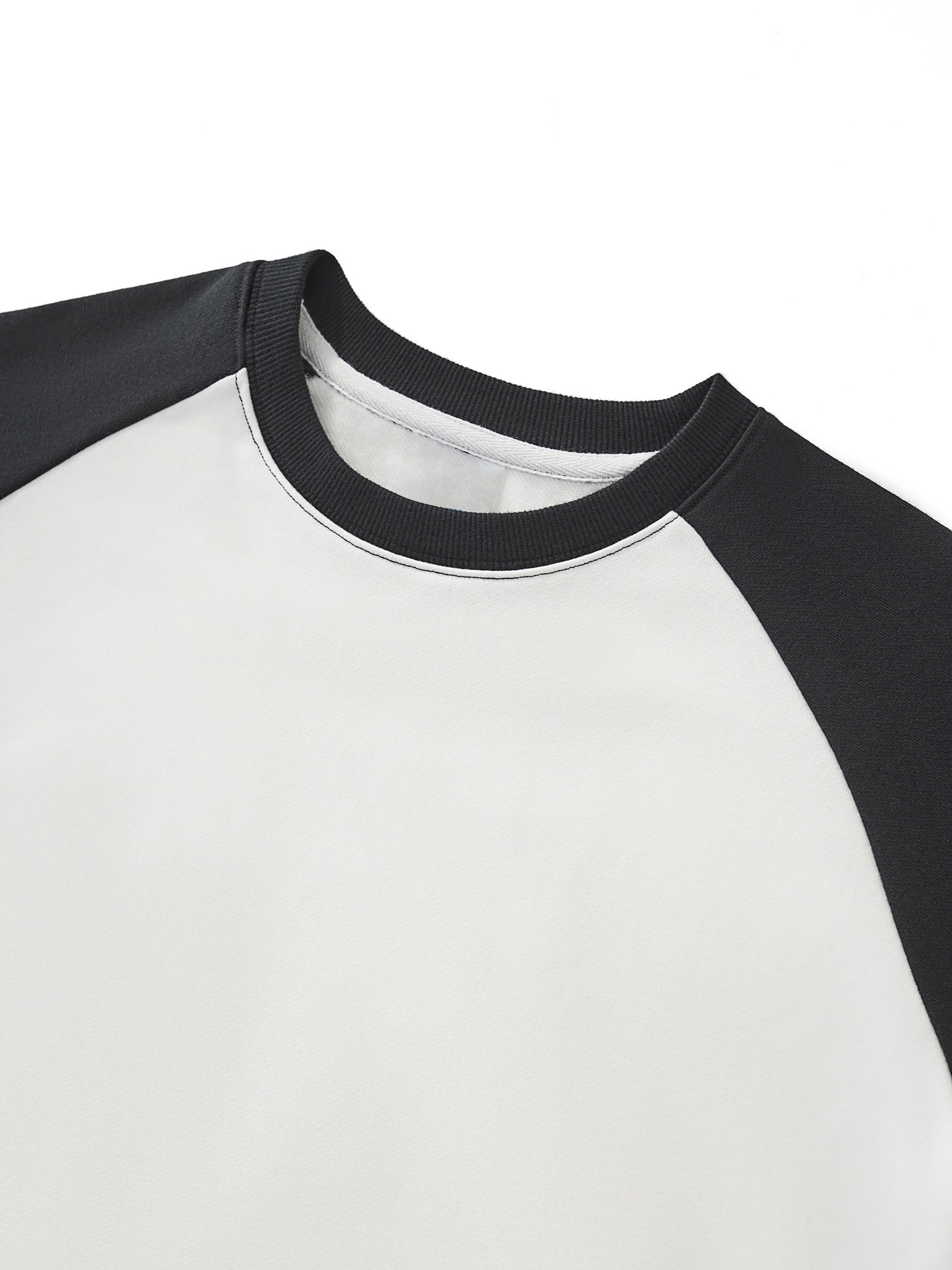 ODMPOD raw-hem color-block raglan crop sweatshirt with contrasting sleeves and a casual, trendy fit.