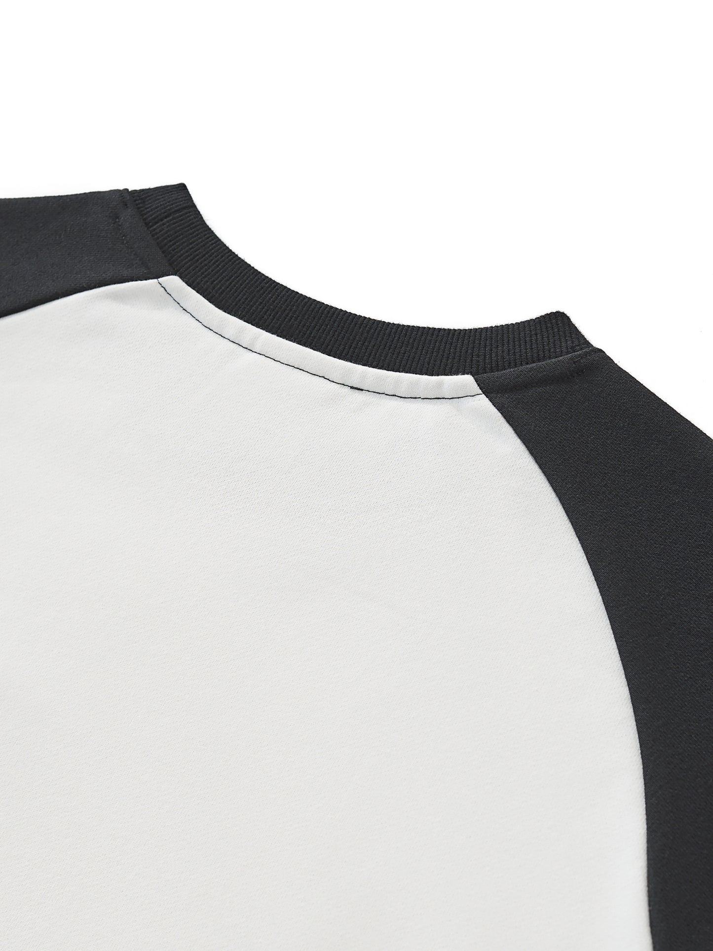 ODMPOD Raw-Hem color-block raglan crop sweatshirt with distressed hem and long sleeves, featuring a casual, sporty design.