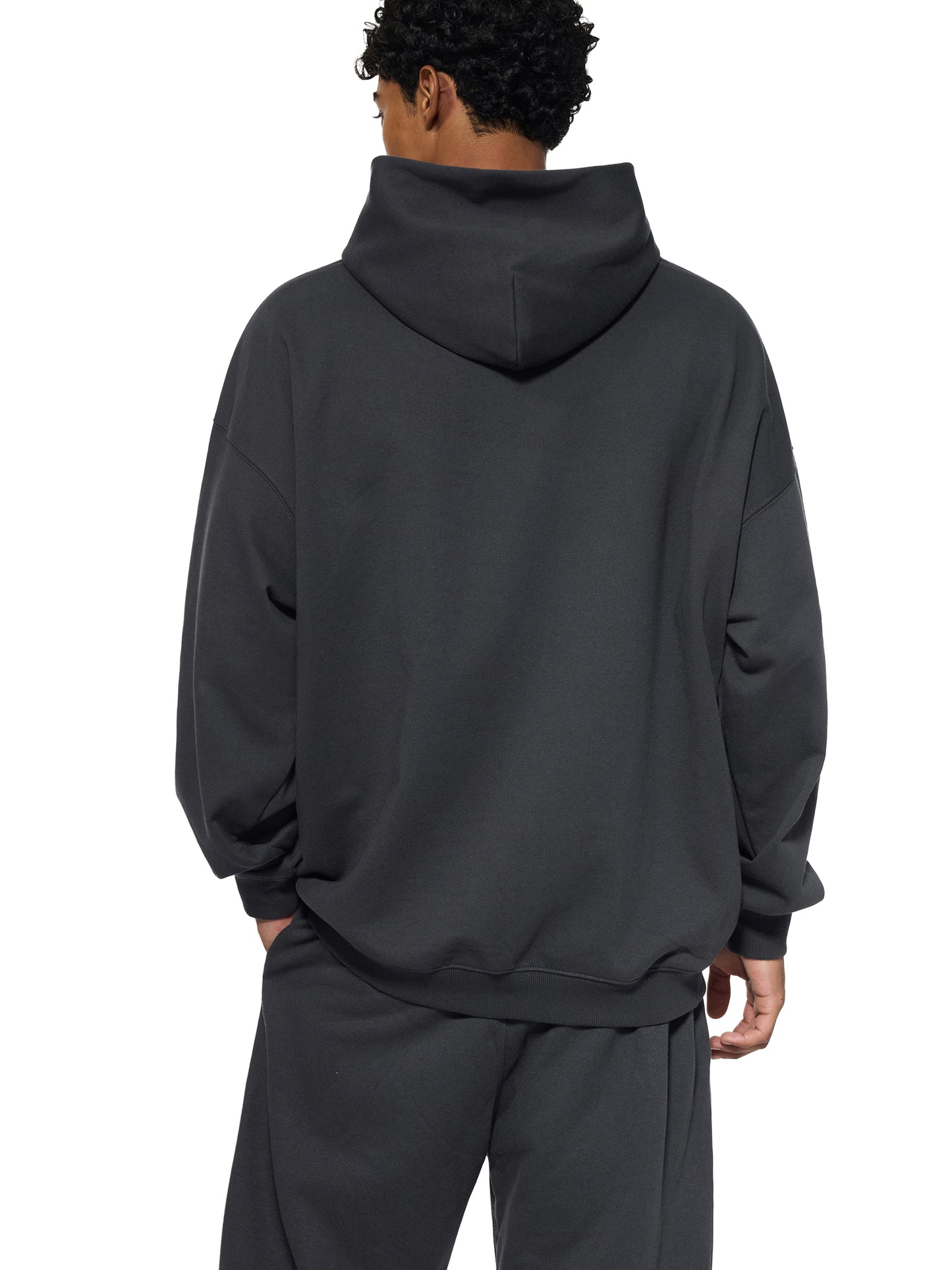 Gray ODMPOD Essential Heavyweight hoodie with front kangaroo pocket and drawstring hood, displayed on a hanger.