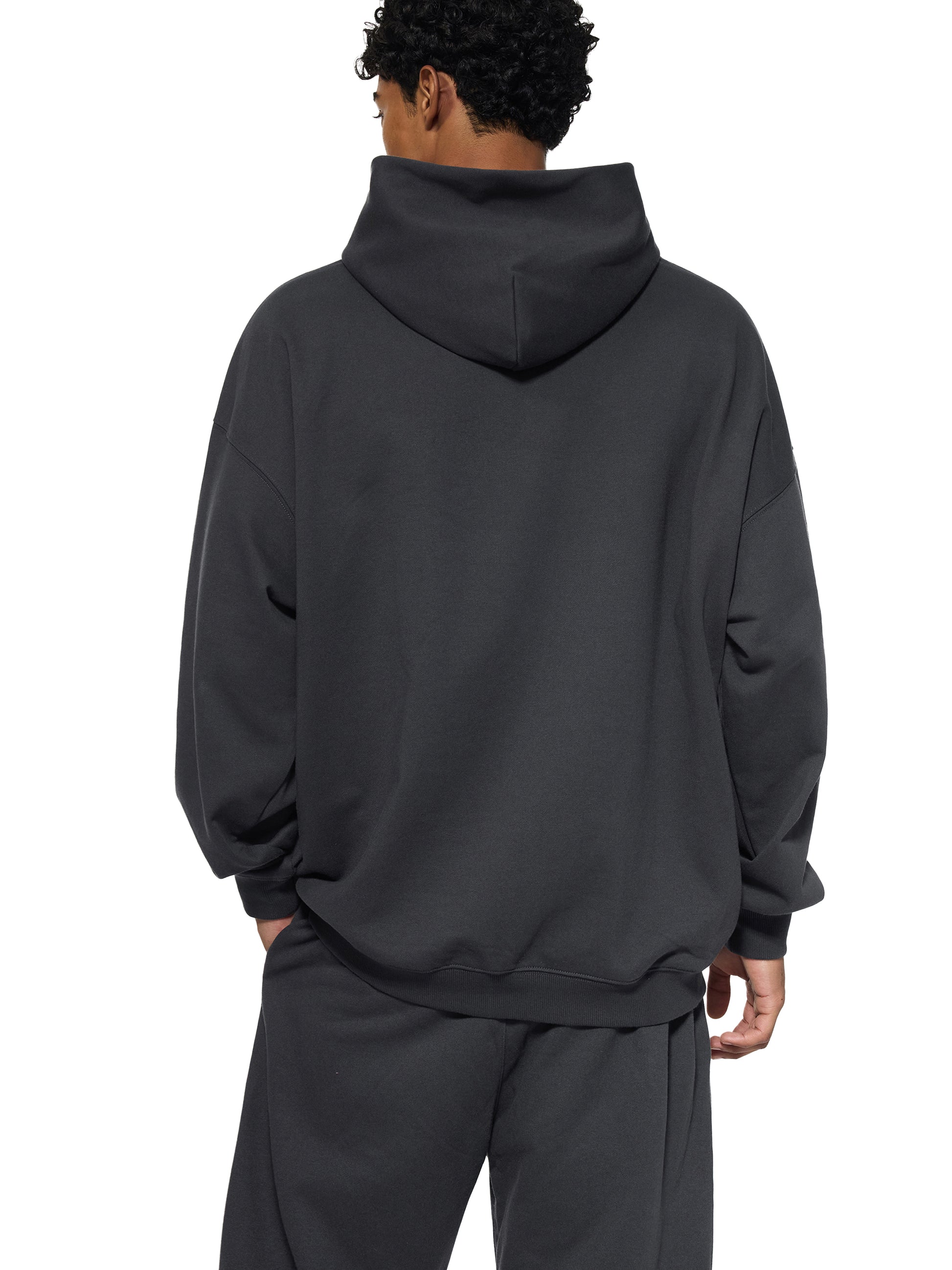 Gray ODMPOD Essential Heavyweight hoodie with front kangaroo pocket and drawstring hood, displayed on a hanger.