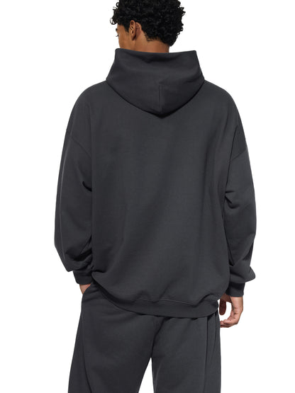 ODMPOD Essential Heavyweight Hoodie, front view showcasing soft fabric, drawstrings, and classic hoodie silhouette.