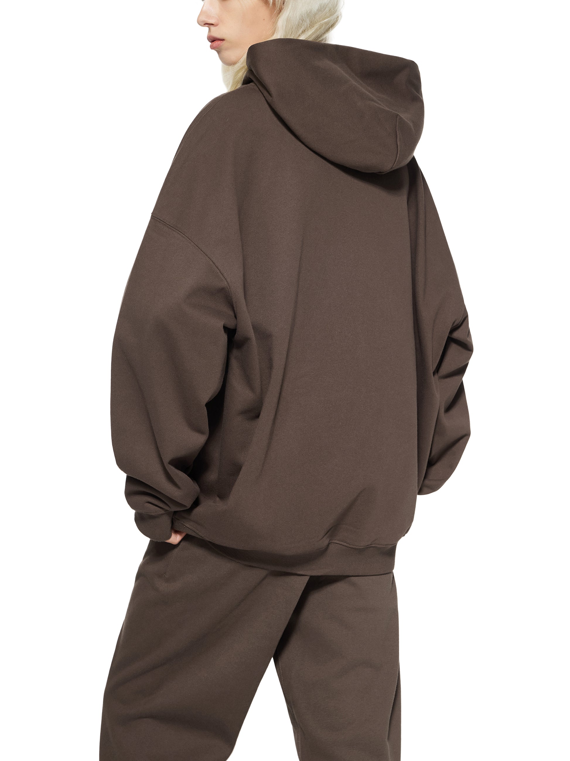 ODMPOD Essential Heavyweight Hoodie shown in gray with a front pocket and drawstring hood, made of soft, durable fabric.