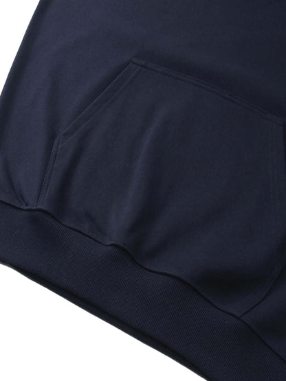 Essential Heavyweight Hoodie from ODMPOD, showing a front view of the cozy, dark-colored hoodie with a drawstring hood and ribbed cuffs.