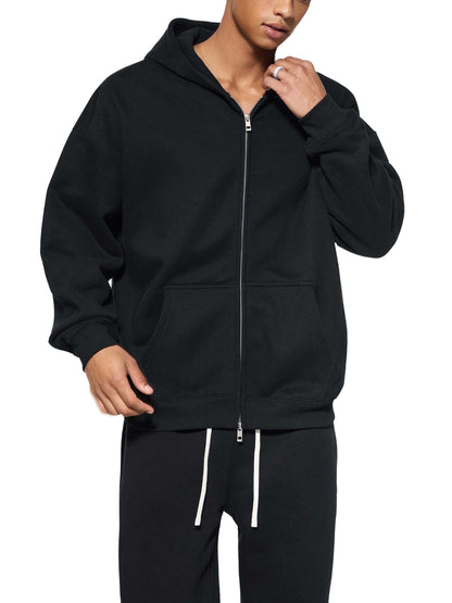 ODMPOD Essential Fleece Zip-Through Hoodie, navy blue with front pockets and adjustable drawstrings, displayed on a hanger.