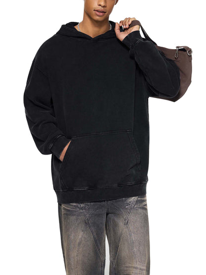 ODMPOD Snow Washed Loose Cotton Hoodie, soft and comfortable with a relaxed fit, displayed in a natural outdoor setting.