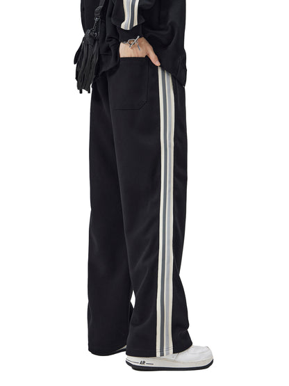 ODMPOD contrast side-stripe straight-leg pants, showcasing a stylish fit with bold side stripes on lightweight fabric.