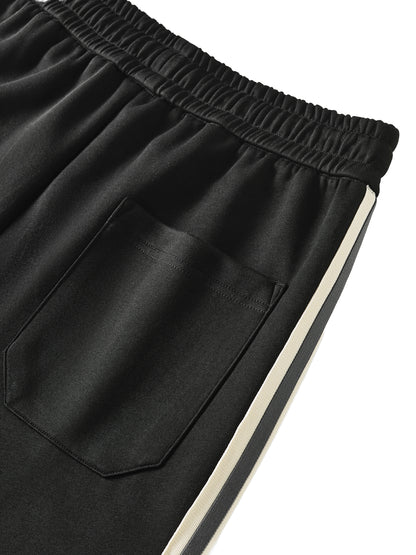 ODMPOD contrast side-stripe straight-leg pants displayed on a model, showcasing the stylish design and fit.