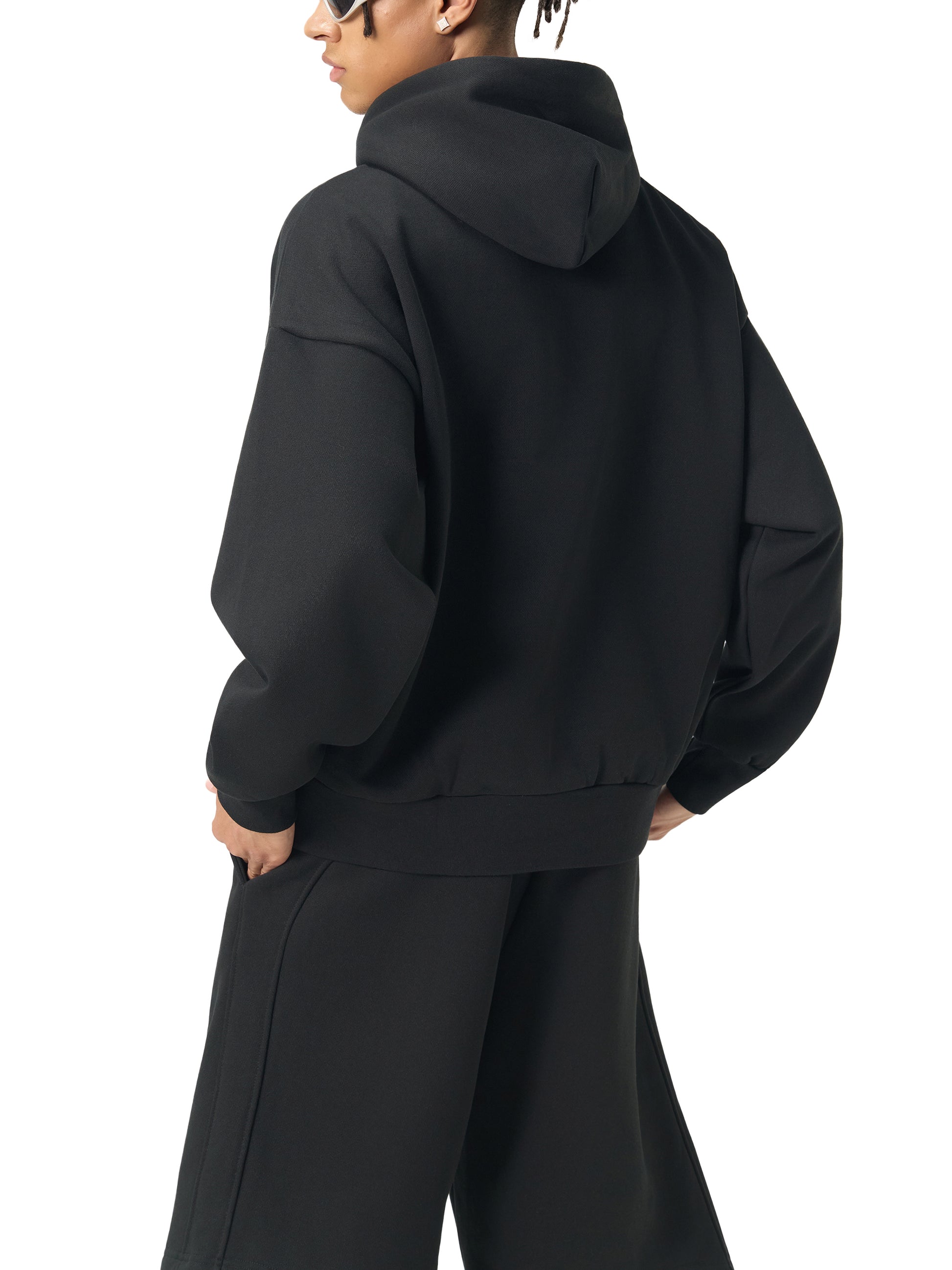 ODMPOD Essential heavyweight fleece hoodie in charcoal, showing front view with soft, thick fabric and hood with drawstrings.