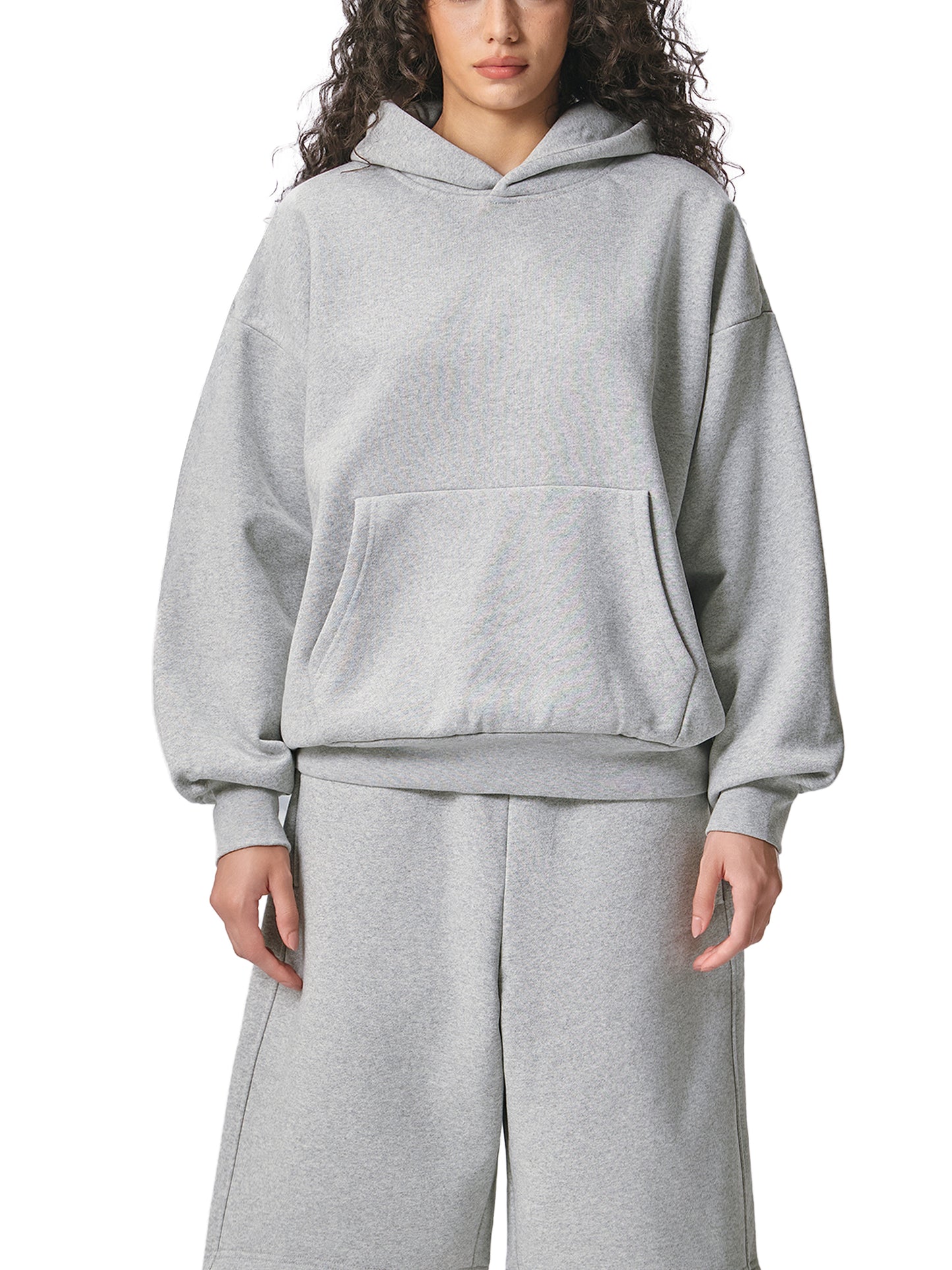 ODMPOD Essential heavyweight fleece hoodie in black, showing front view with hood and long sleeves.