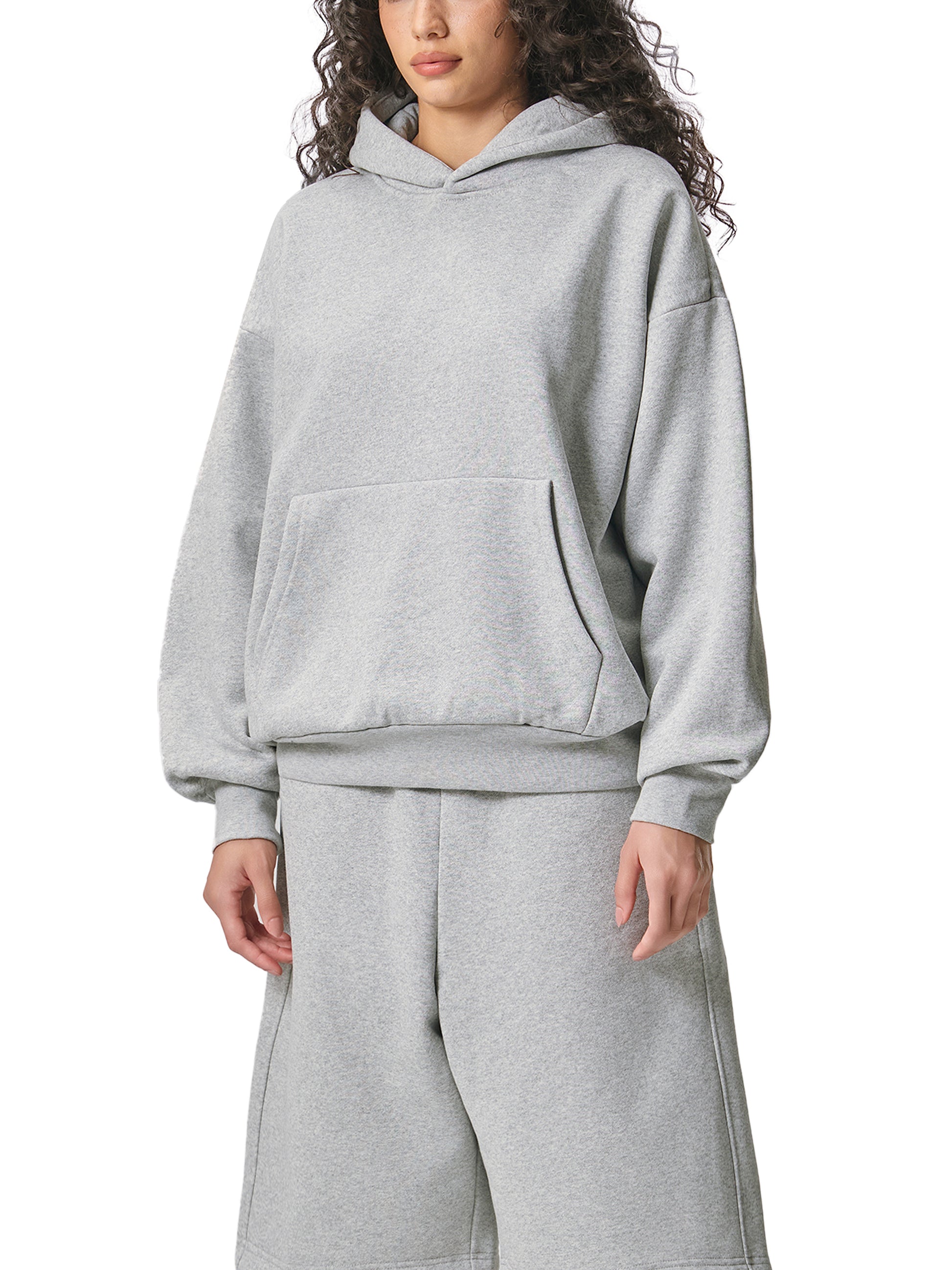 ODMPOD Essential heavyweight fleece hoodie in gray, showing front view with hood and drawstrings, cozy and warm casual wear.